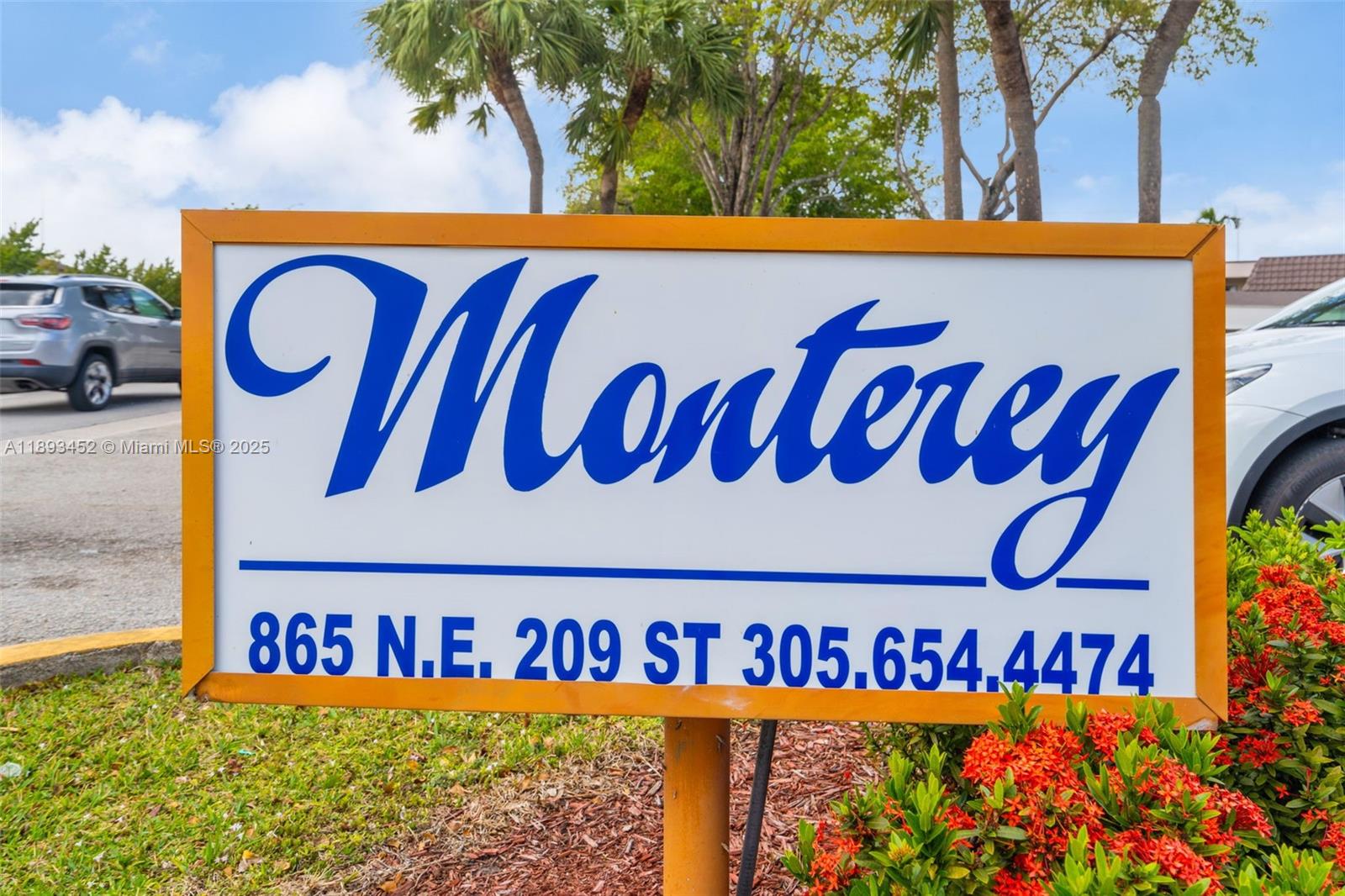 821 Northeast 207th Lane, Unit 1105 Miami, FL 33179 - Photo 2 of 12 a street sign