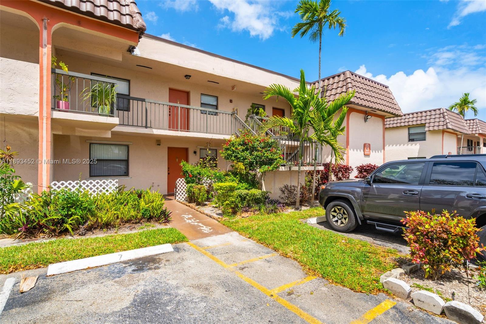 821 Northeast 207th Lane, Unit 1105 Miami, FL 33179 - Photo 4 of 12 a house view with a garden space