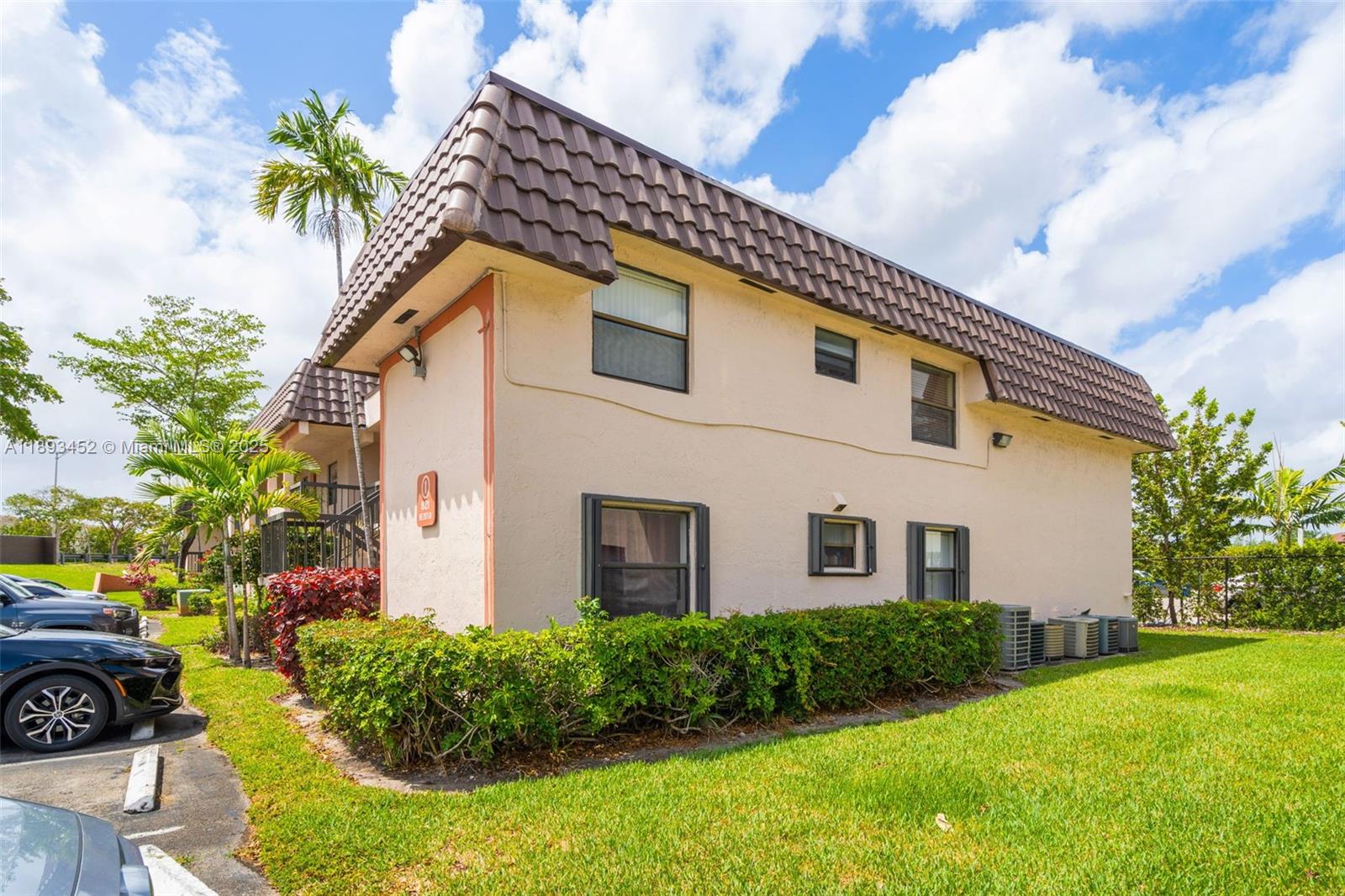 821 Northeast 207th Lane, Unit 1105 Miami, FL 33179 - Photo 5 of 12 a house view with a garden space