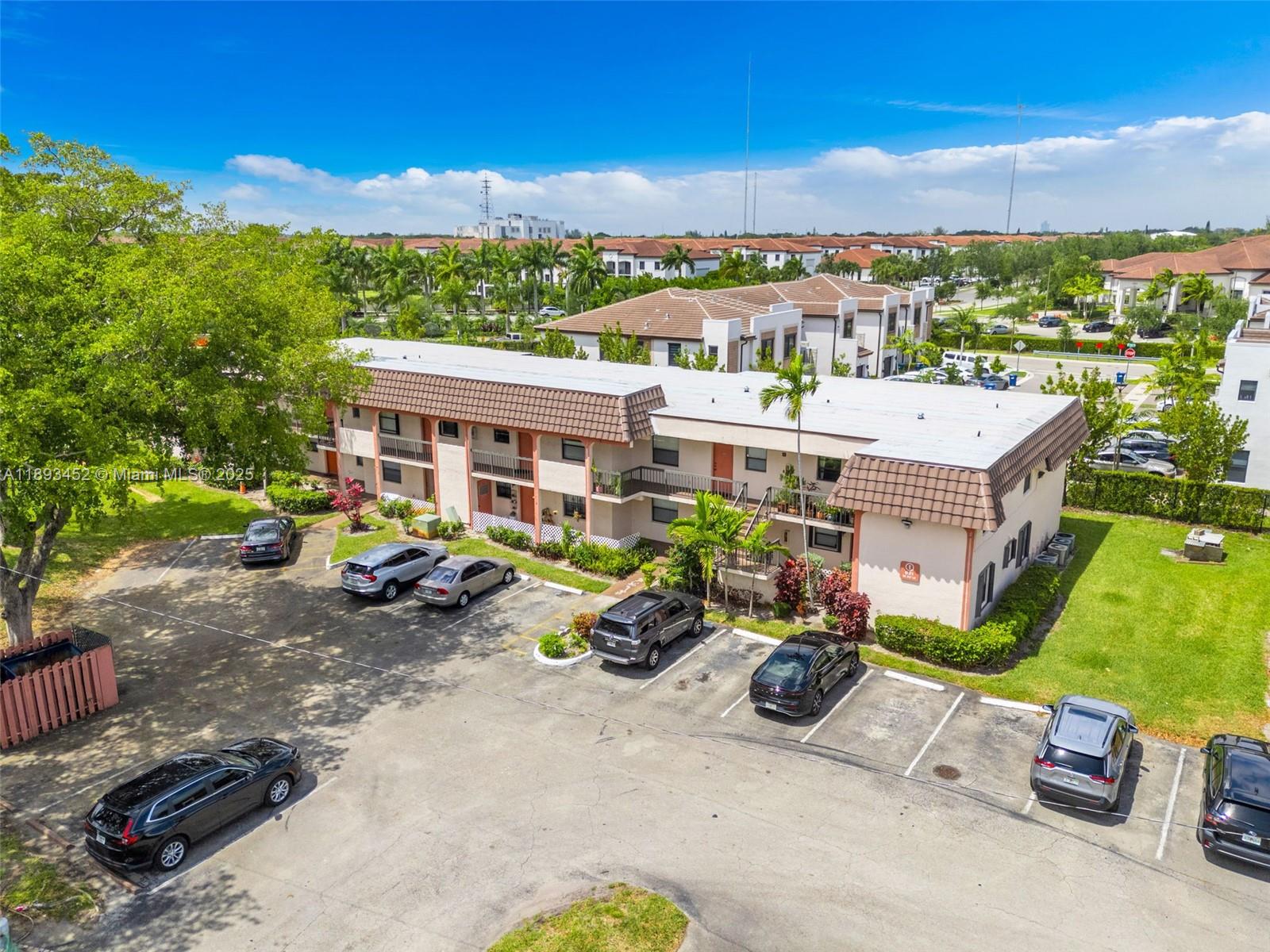 821 Northeast 207th Lane, Unit 1105 Miami, FL 33179 - Photo 6 of 12 a view of a parking space with a patio