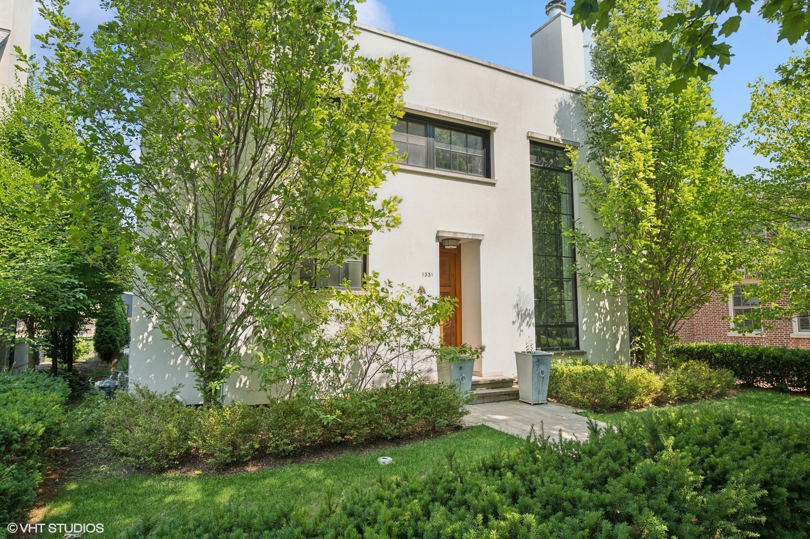 1331 Asbury Avenue Evanston, IL 60201 - Photo 1 of 46 a view of a house with a yard and plants