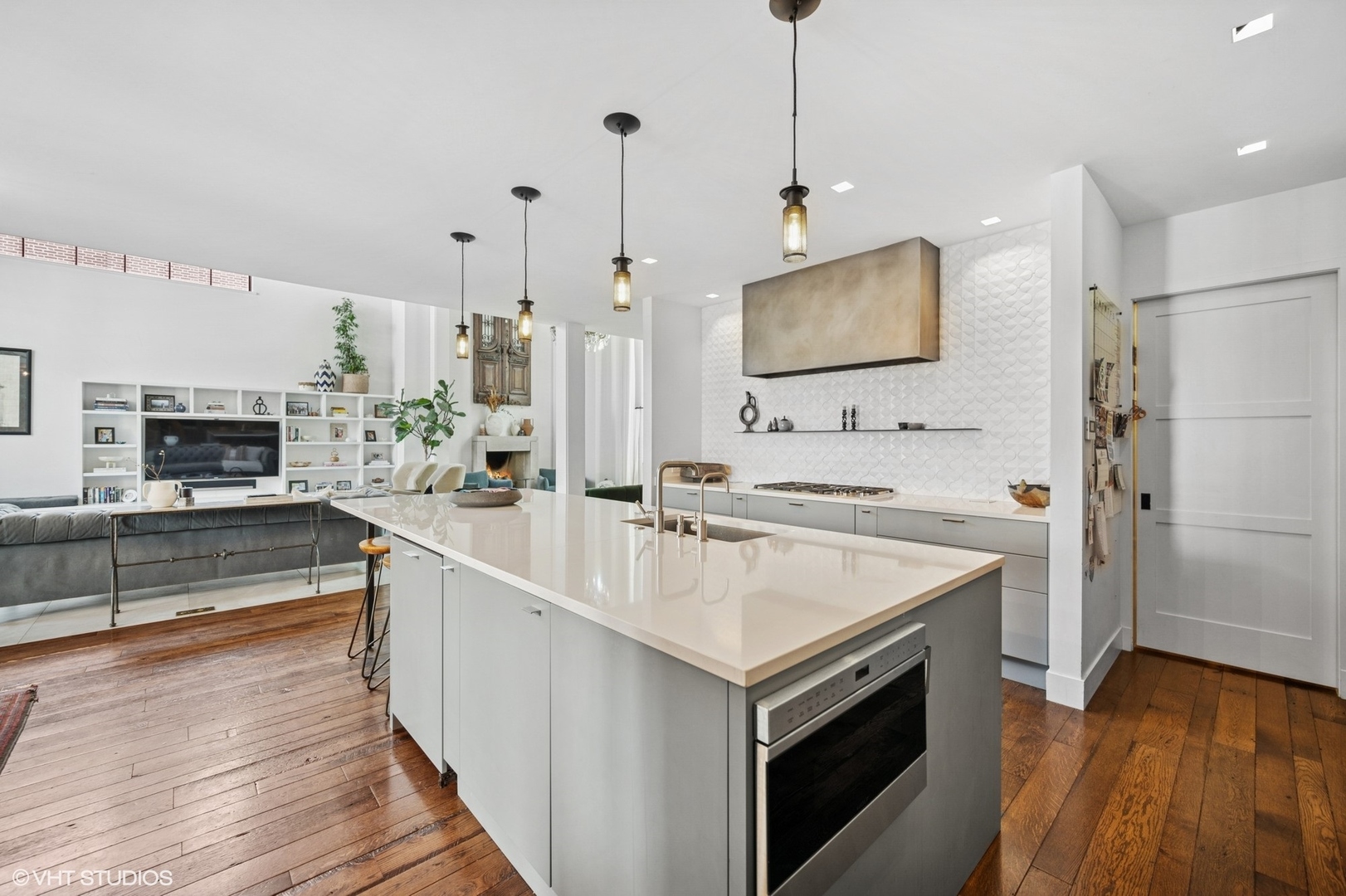 1331 Asbury Avenue Evanston, IL 60201 - Photo 14 of 46 a kitchen with stainless steel appliances granite countertop a sink a stove and a wooden floor