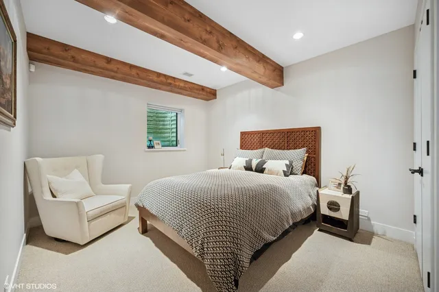 a bedroom with bed and a couch