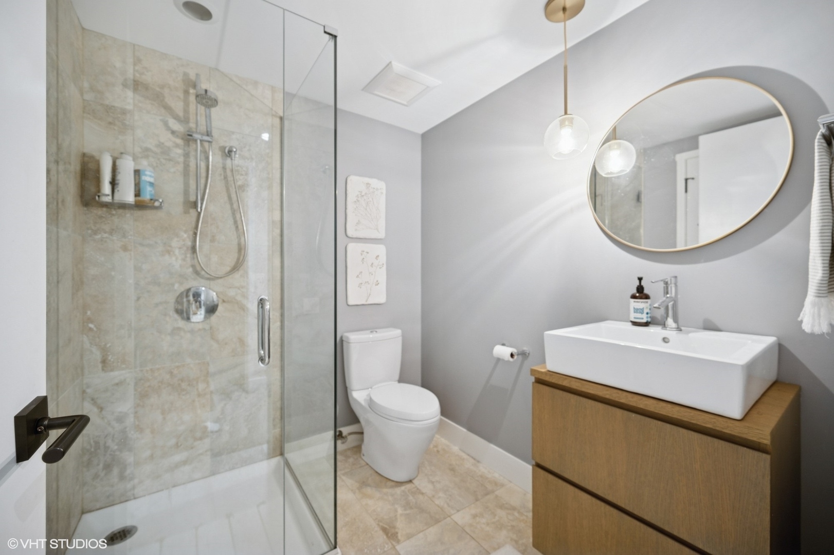 1331 Asbury Avenue Evanston, IL 60201 - Photo 38 of 46 a bathroom with a sink toilet and shower