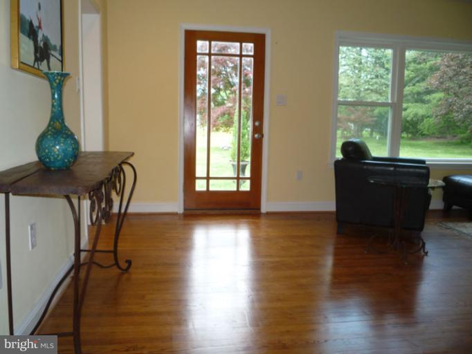 20300 Whites Ferry Road Poolesville, MD 20837 - Photo 12 of 30 a living room with furniture and a large window