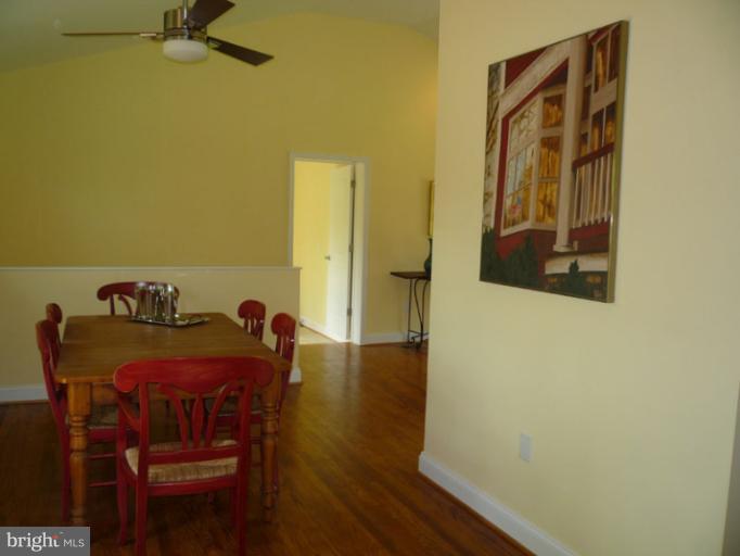 20300 Whites Ferry Road Poolesville, MD 20837 - Photo 15 of 30 a dining room with furniture and wooden floor