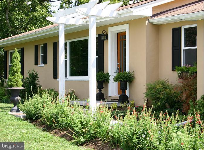 20300 Whites Ferry Road Poolesville, MD 20837 - Photo 17 of 30 a view of a house with potted plants
