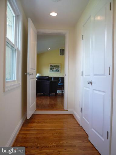 20300 Whites Ferry Road Poolesville, MD 20837 - Photo 18 of 30 a view of a living room and bathroom with a sink