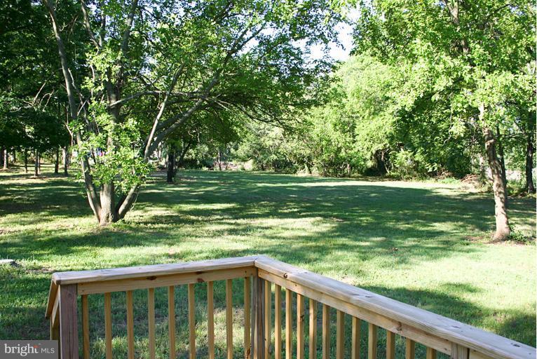 20300 Whites Ferry Road Poolesville, MD 20837 - Photo 21 of 30 a view of outdoor space with deck and yard