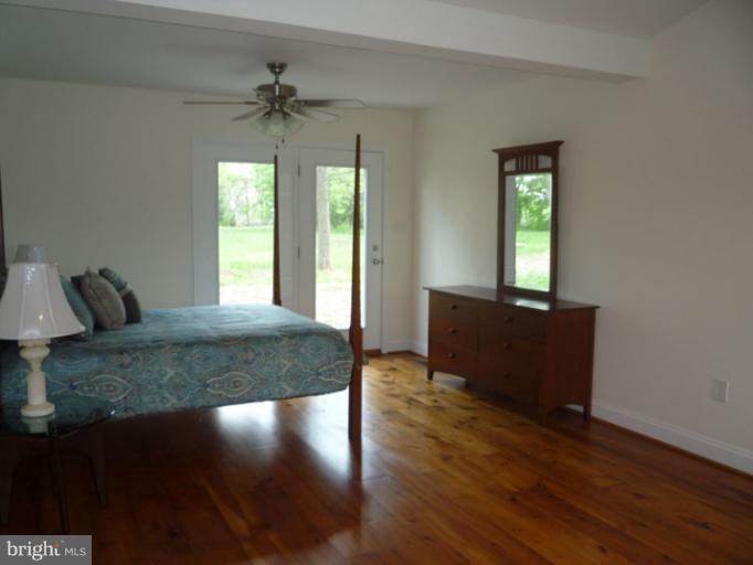 20300 Whites Ferry Road Poolesville, MD 20837 - Photo 25 of 30 a view of a livingroom with furniture window and wooden floor
