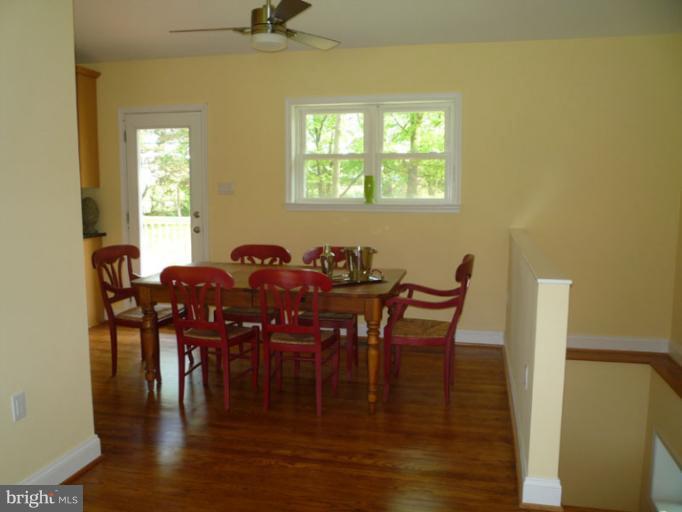 20300 Whites Ferry Road Poolesville, MD 20837 - Photo 26 of 30 a view of a dining room with furniture and wooden floor