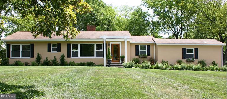 20300 Whites Ferry Road Poolesville, MD 20837 - Photo 30 of 30 a front view of a house with garden
