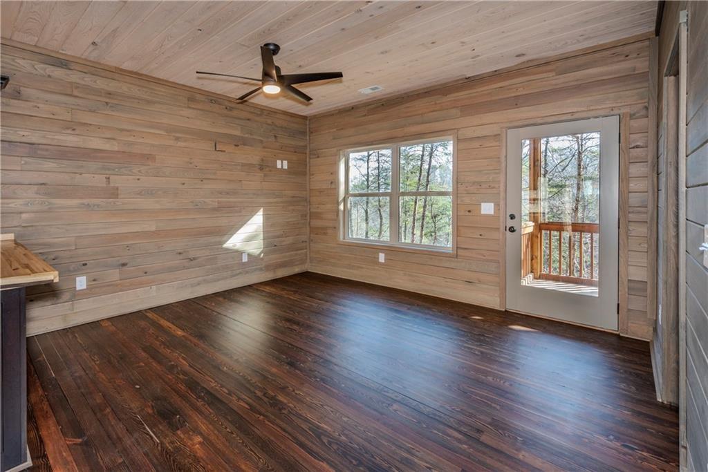 1041 Astro Court Northeast Ranger, GA 30734 - Photo 17 of 52 a view of an empty room with wooden floor and a window
