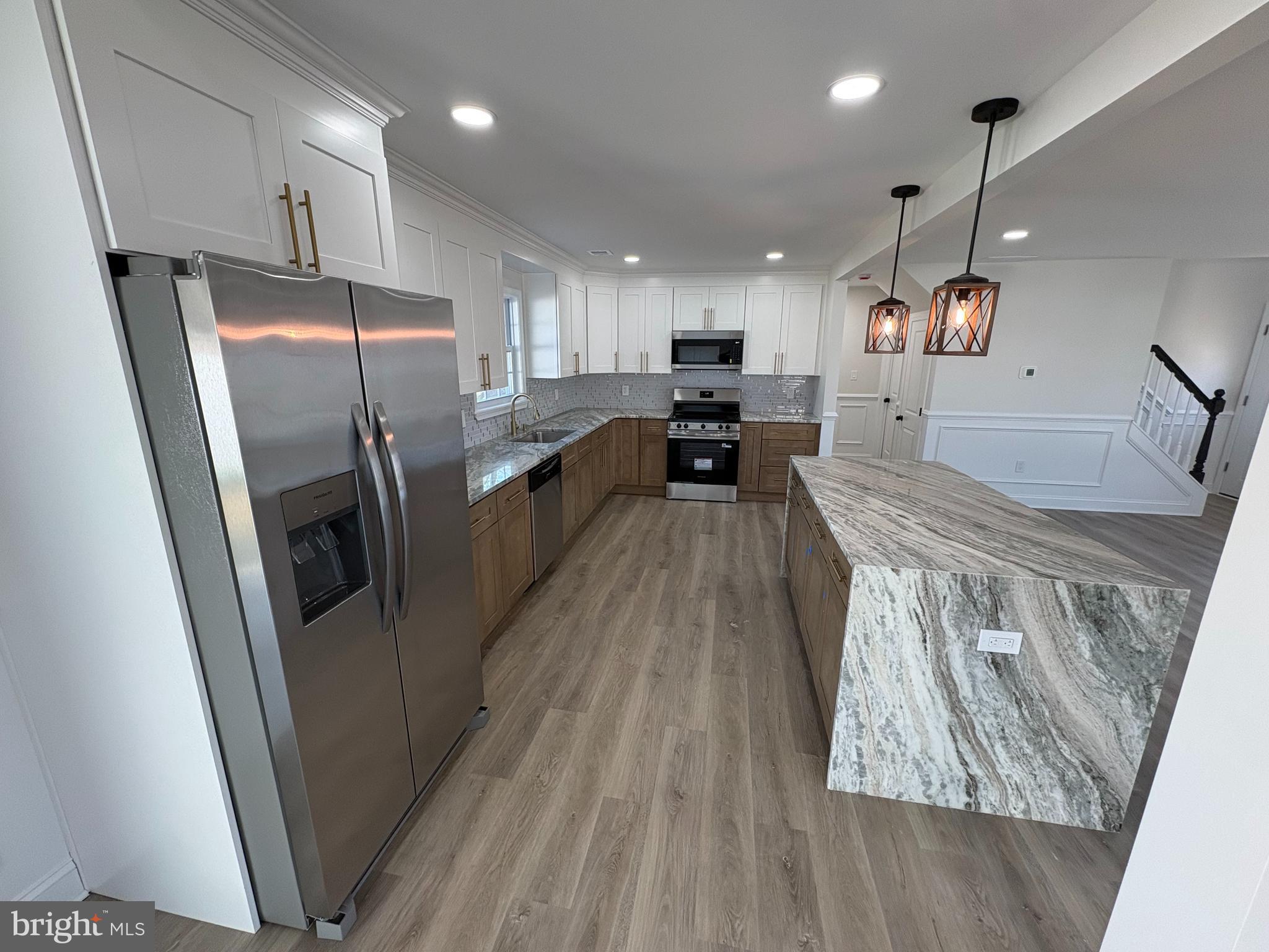 50 Micahill Road Levittown, PA 19056 - Photo 12 of 45 a view of a kitchen with a sink and refrigerator