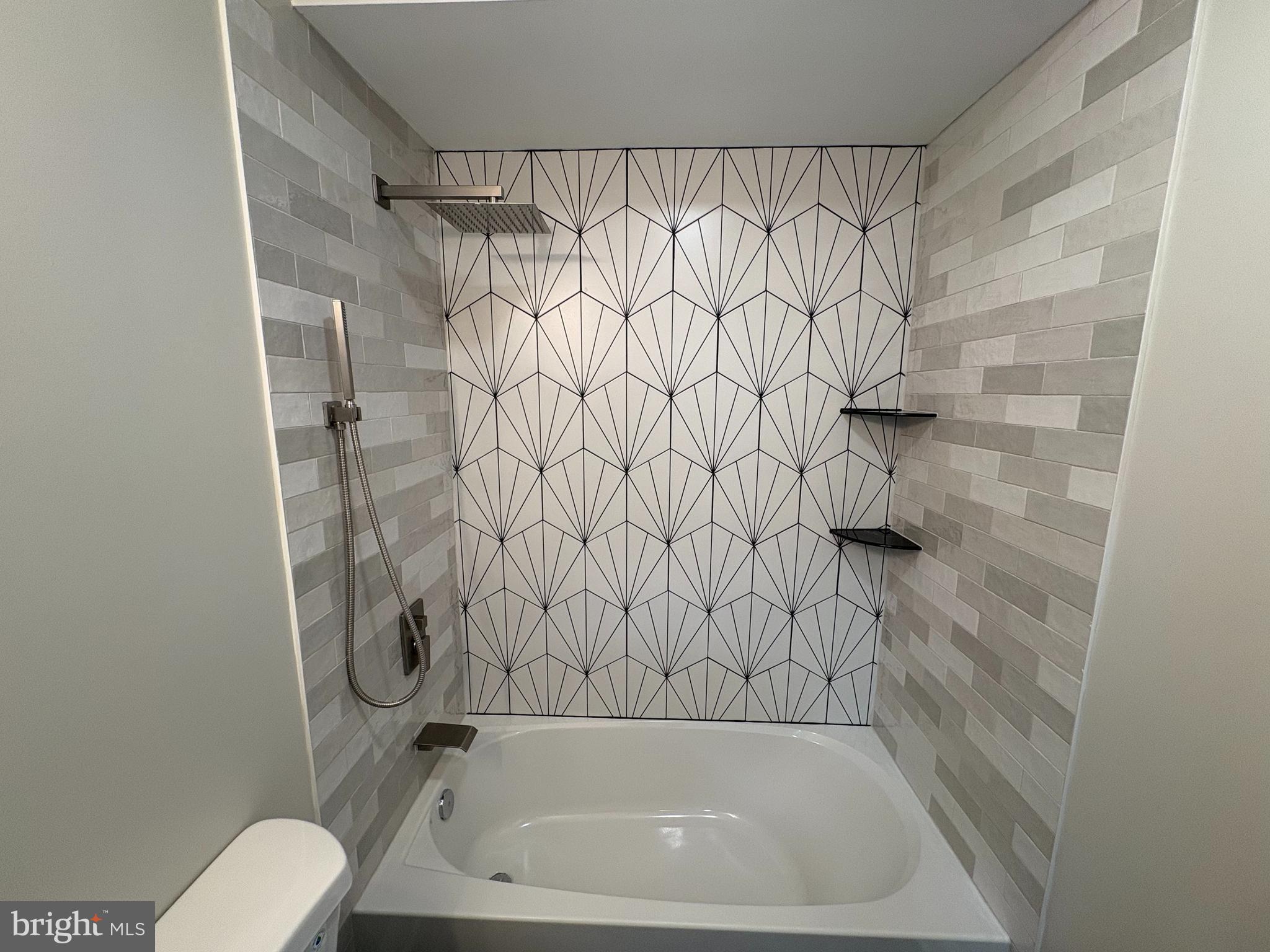 50 Micahill Road Levittown, PA 19056 - Photo 16 of 45 a bathroom with a bathtub and shower