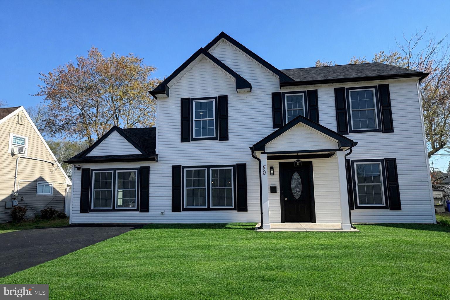 50 Micahill Road Levittown, PA 19056 - Photo 2 of 45 a front view of a house with a yard