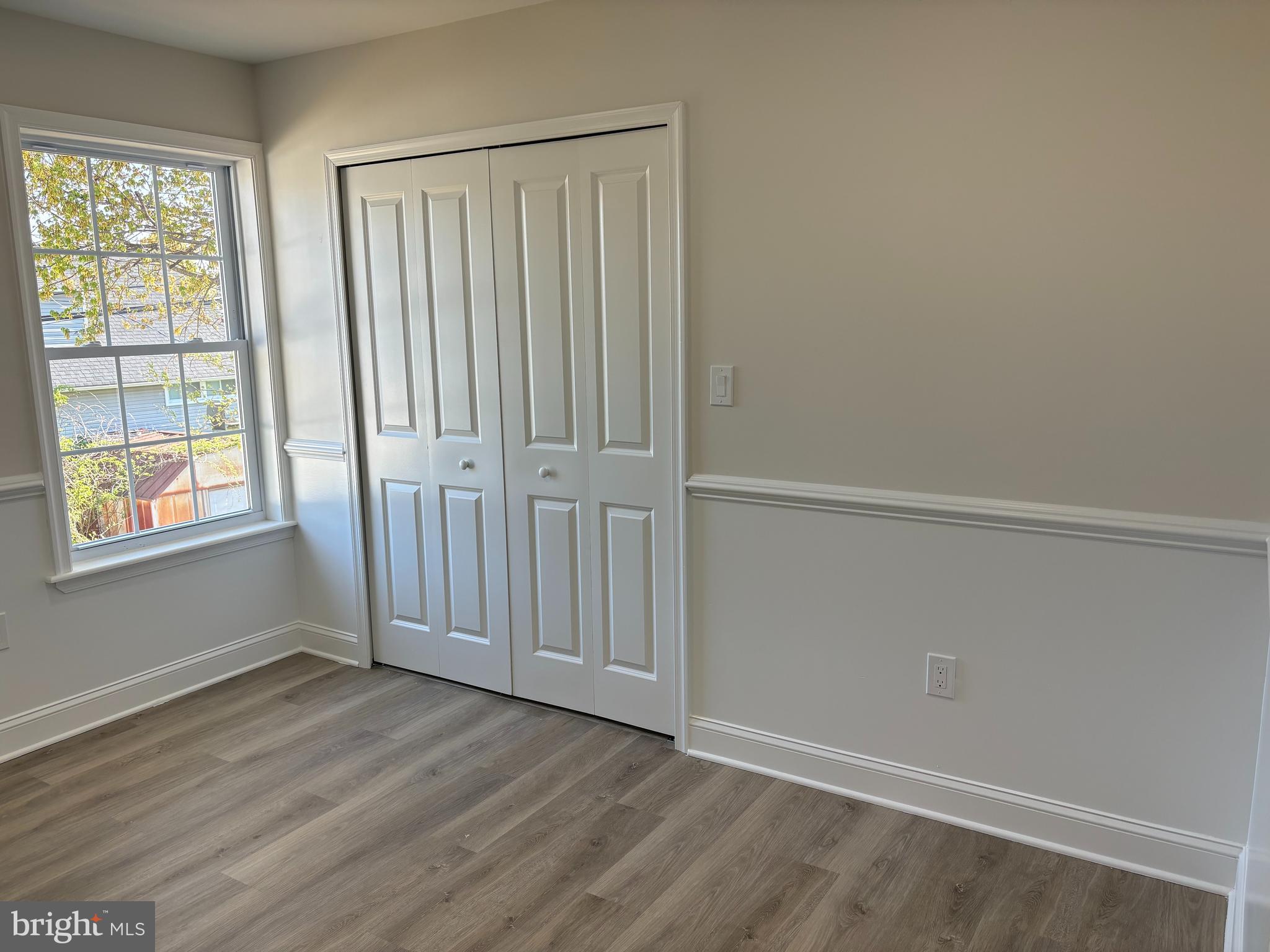 50 Micahill Road Levittown, PA 19056 - Photo 25 of 45 an empty room with wooden floor and windows