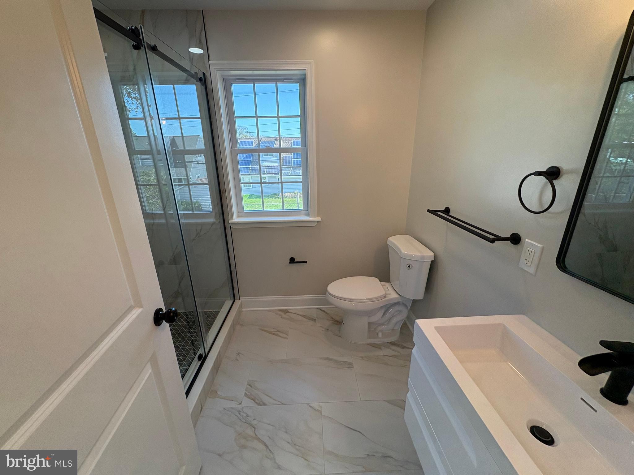 50 Micahill Road Levittown, PA 19056 - Photo 27 of 45 a bathroom with a sink a toilet and a tub