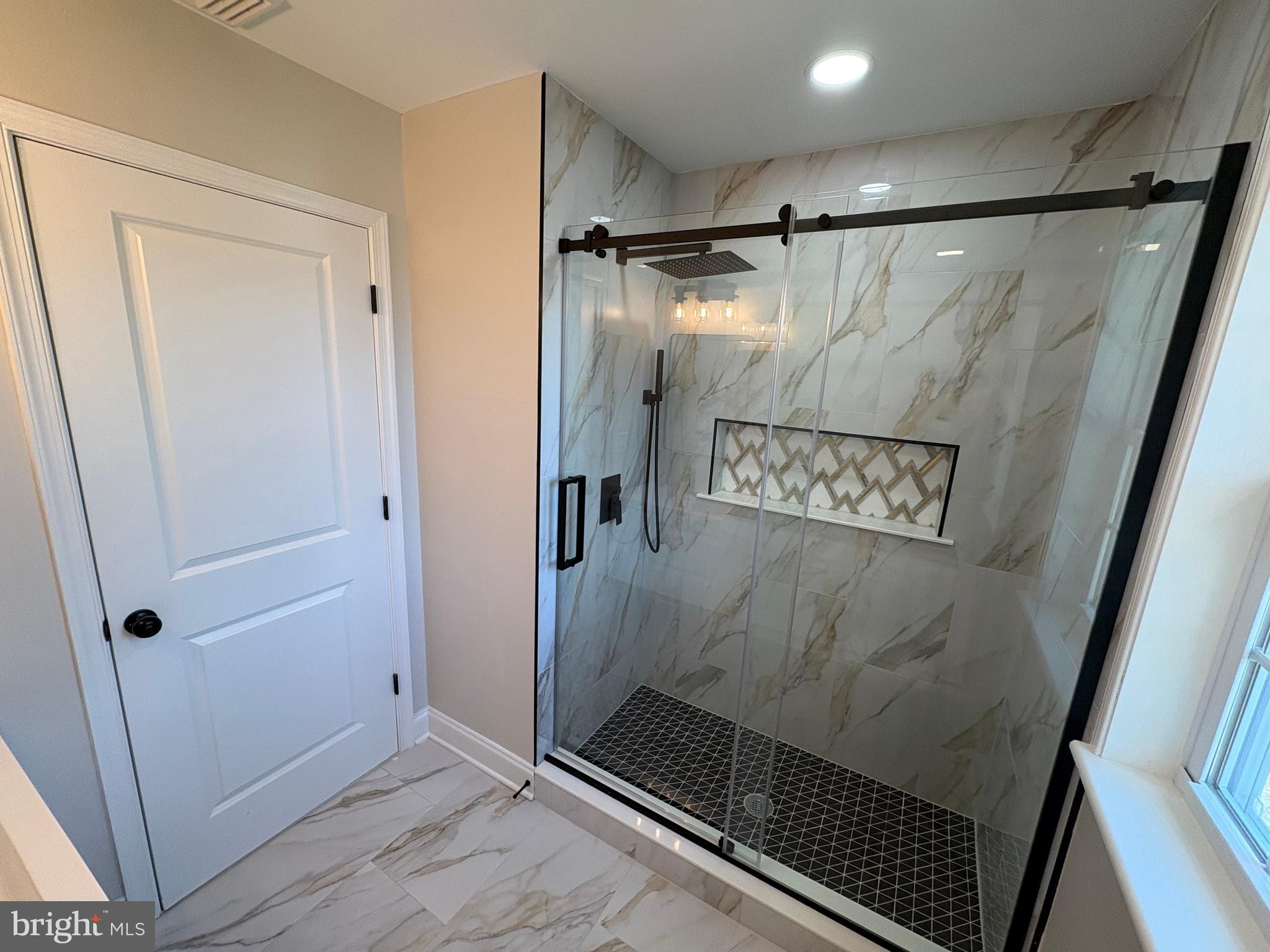 50 Micahill Road Levittown, PA 19056 - Photo 29 of 45 a bathroom with a shower and a sink