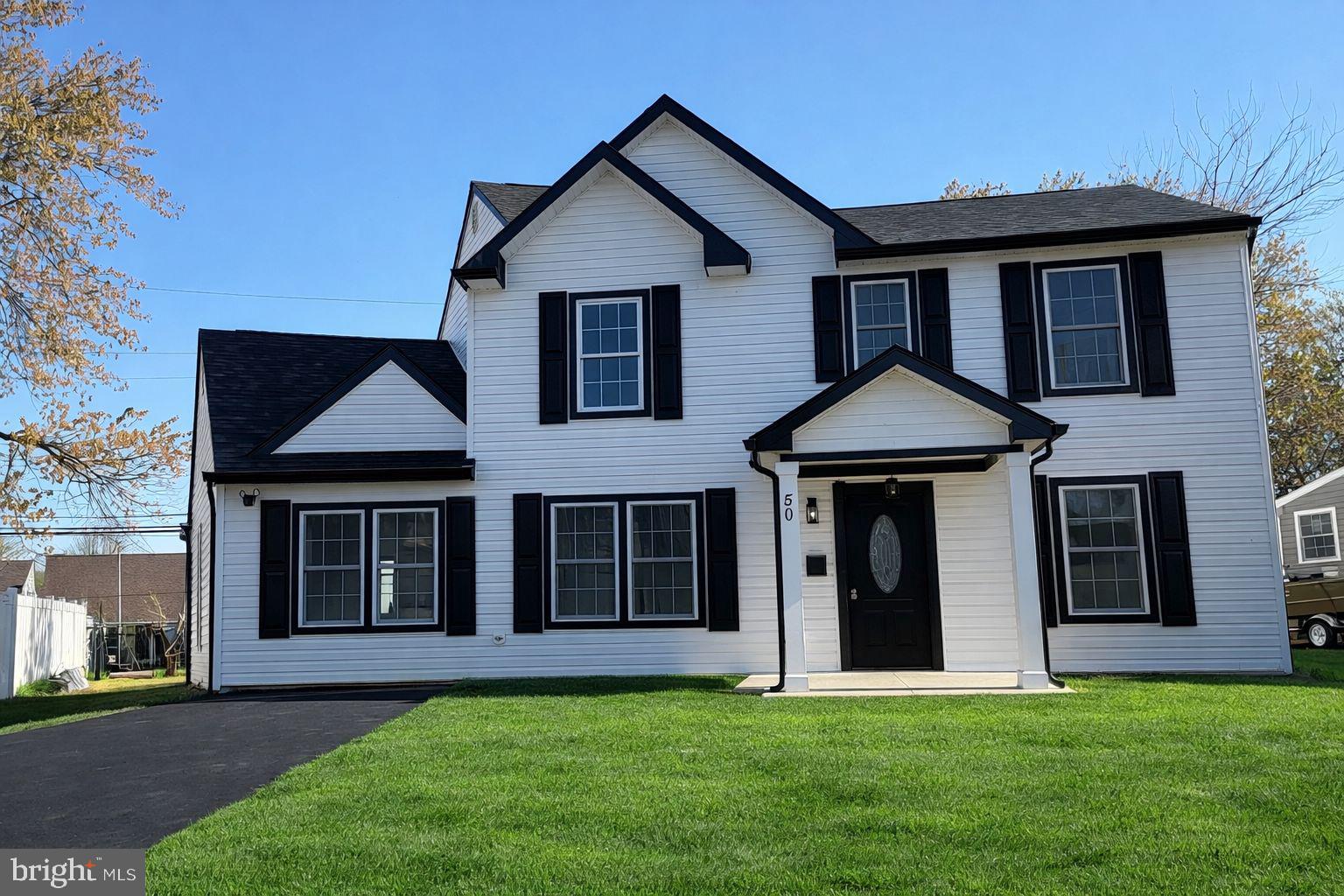 50 Micahill Road Levittown, PA 19056 - Photo 3 of 45 a front view of a house with a yard