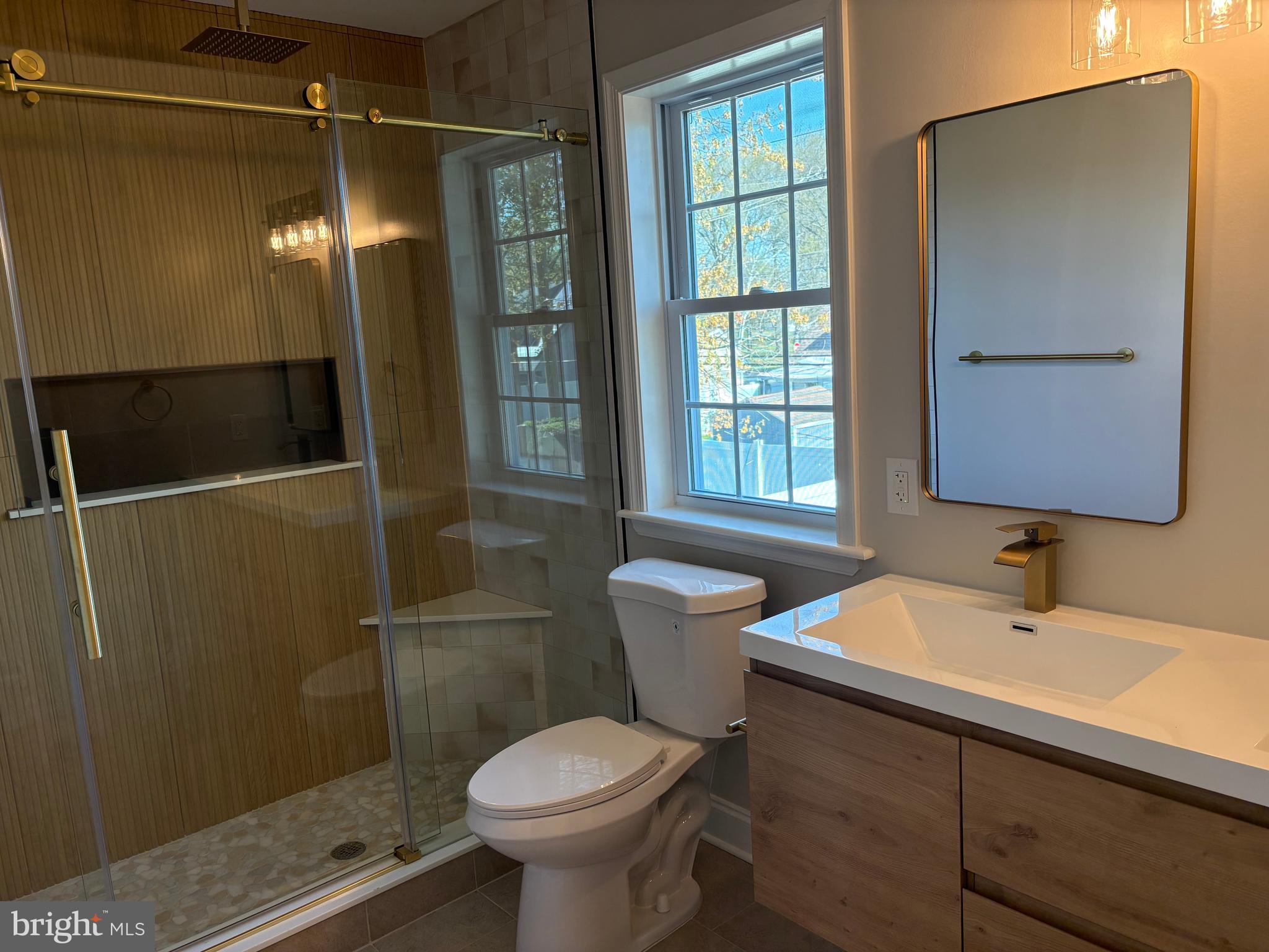 50 Micahill Road Levittown, PA 19056 - Photo 39 of 45 a bathroom with a sink toilet and shower
