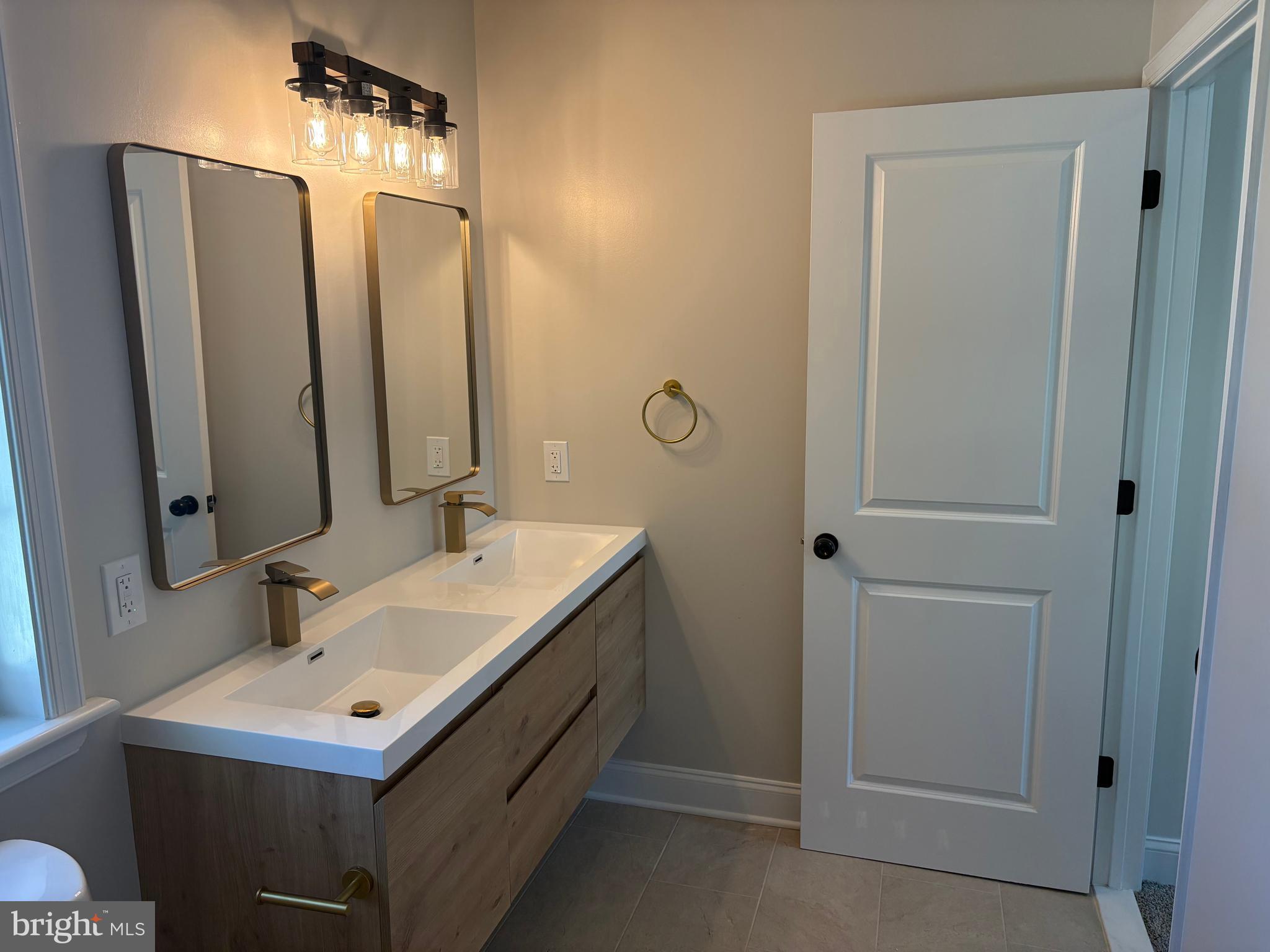 50 Micahill Road Levittown, PA 19056 - Photo 40 of 45 a bathroom with a sink and a mirror