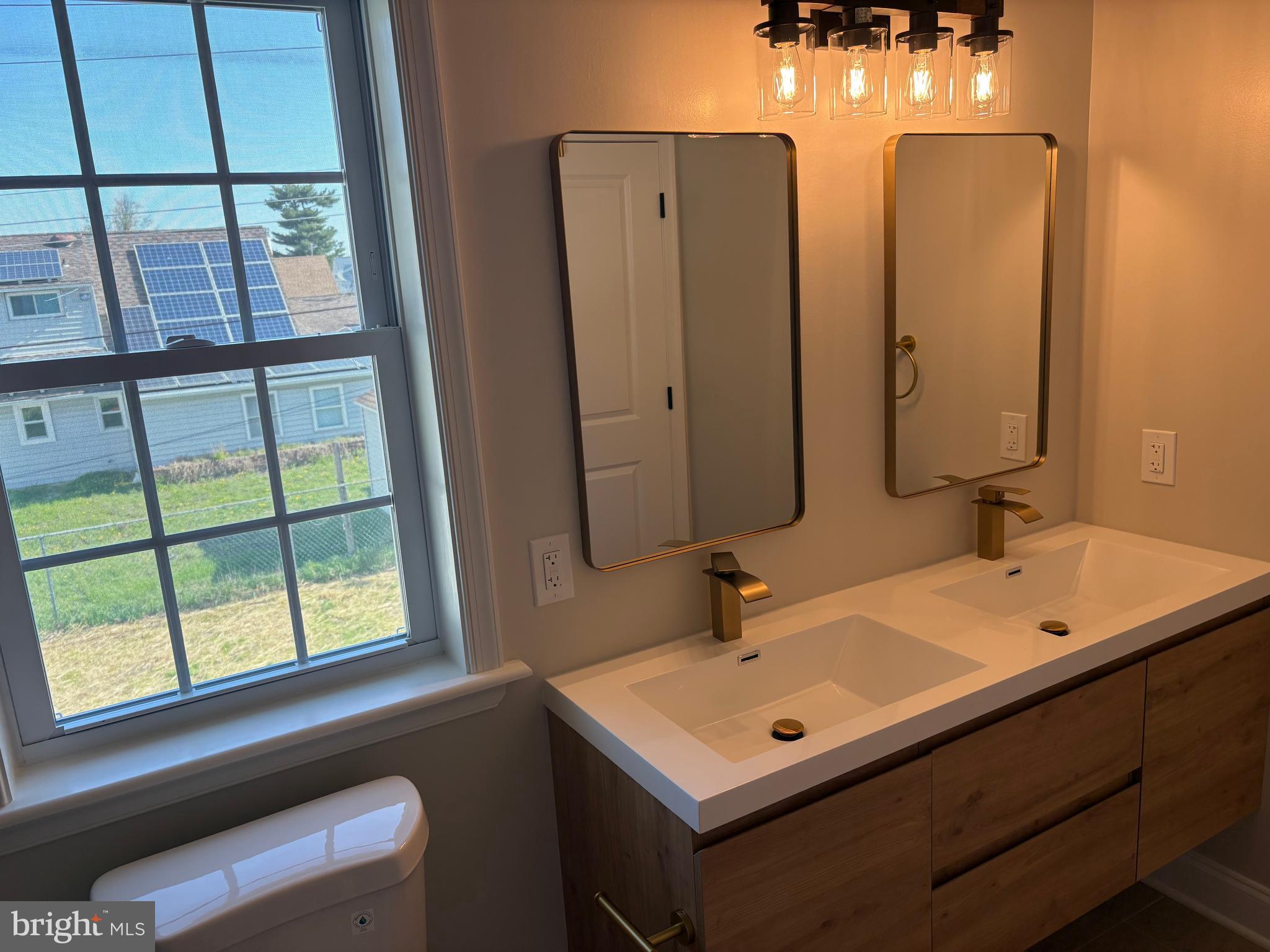 50 Micahill Road Levittown, PA 19056 - Photo 41 of 45 a bathroom with a sink and a mirror