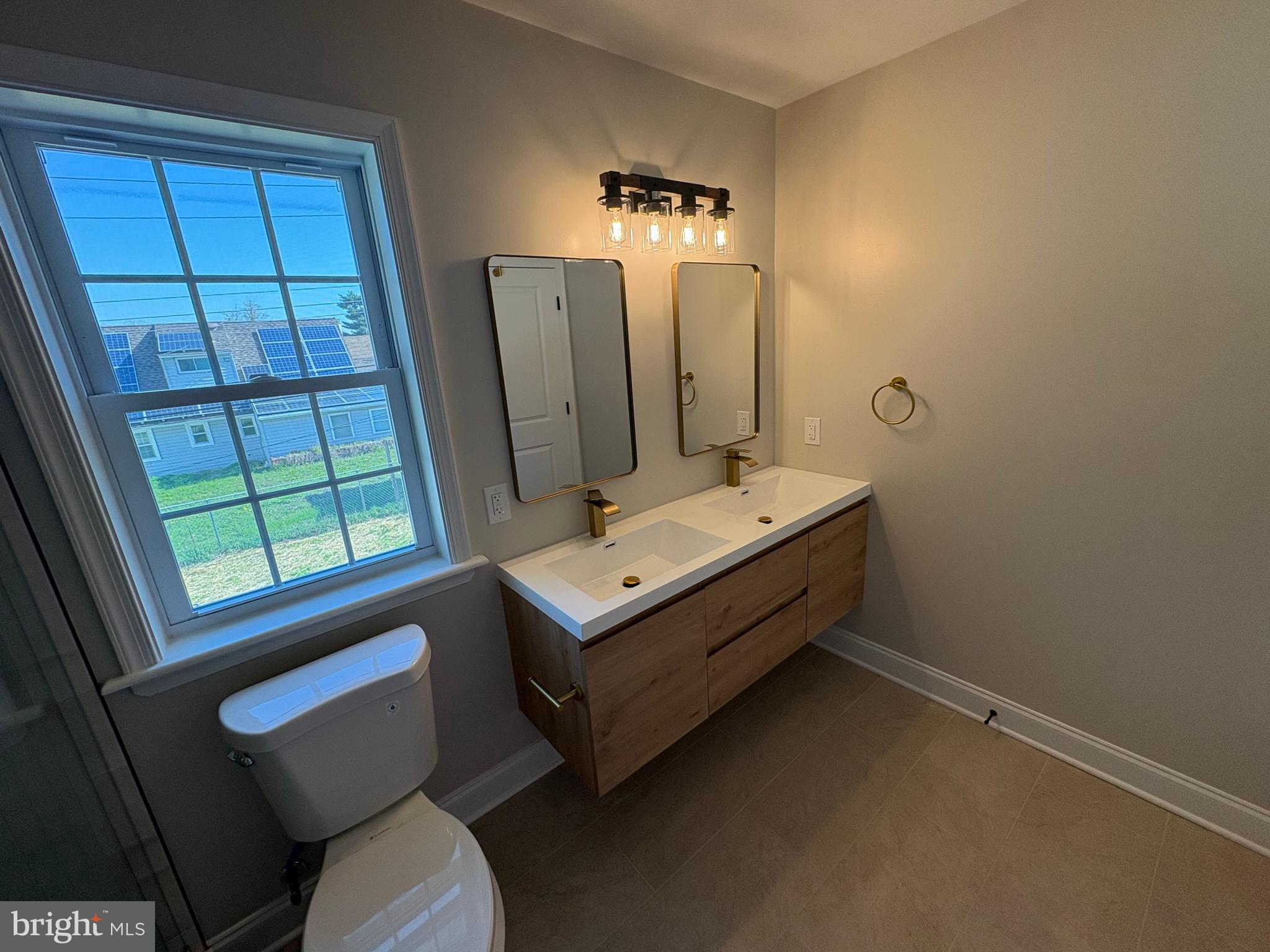 50 Micahill Road Levittown, PA 19056 - Photo 42 of 45 a bathroom with a sink toilet and mirror