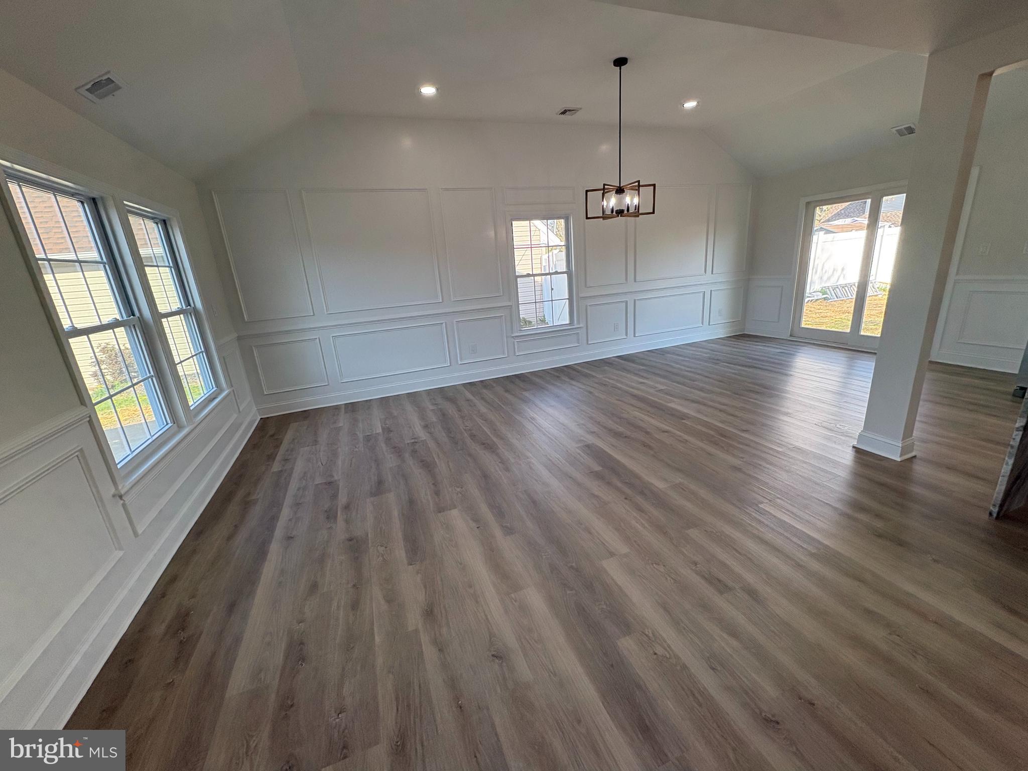 50 Micahill Road Levittown, PA 19056 - Photo 5 of 45 an empty room with wooden floor and windows