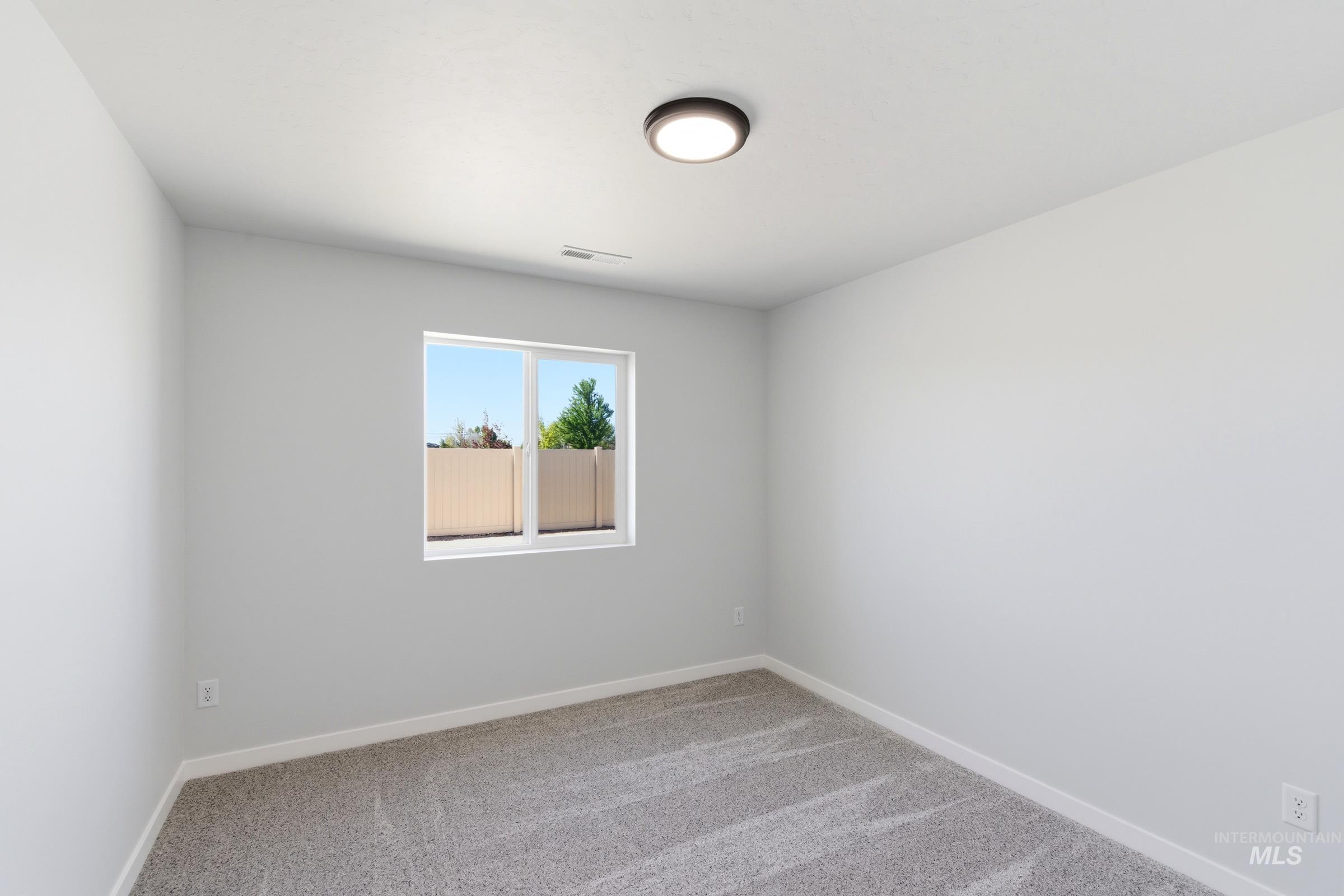 13677 Redway Court Caldwell, ID 83607 - Photo 26 of 35 Room featuring light gray walls, gray carpet, white baseboards, and a single window with a white frame