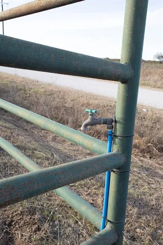 a view of a lake with sunset in the background