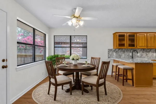 a dining room with furniture and window