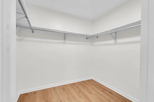 a view of an empty walk in closet