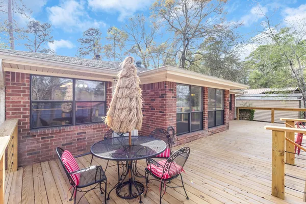 a view of a patio with a table and chairs