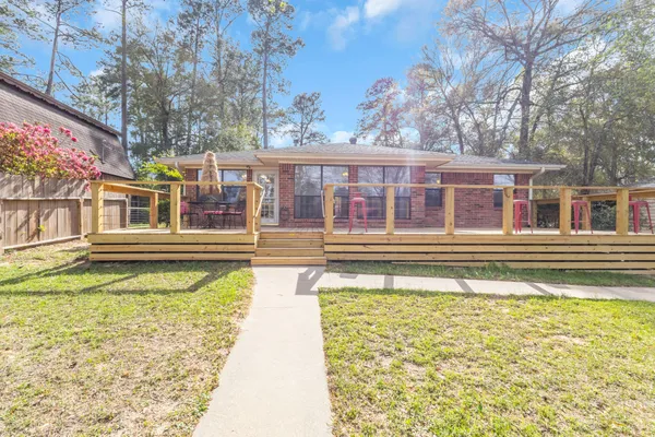 a house with swimming pool in front of it
