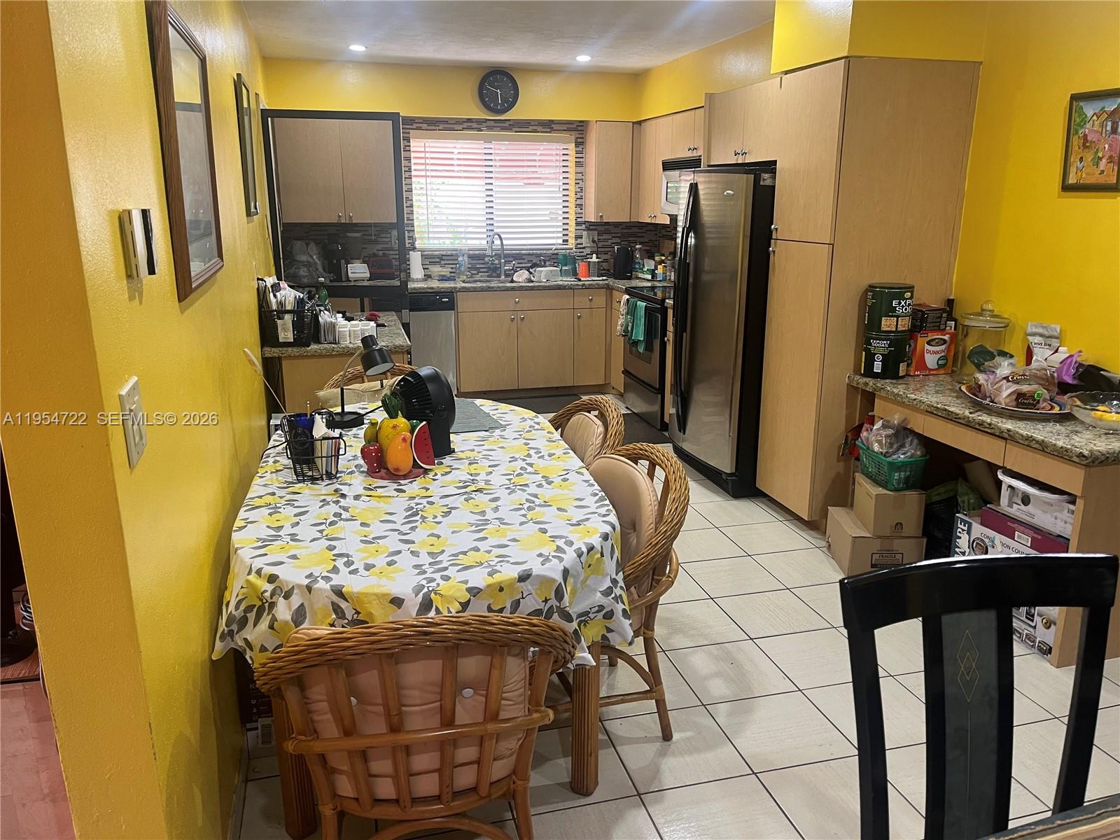 11041 Southwest 166th Terrace Miami, FL 33157 - Photo 11 of 26 a very nice looking dining room with a dining table chairs