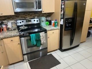 11041 Southwest 166th Terrace Miami, FL 33157 - Photo 12 of 26 a kitchen with stainless steel appliances granite countertop a refrigerator and a stove