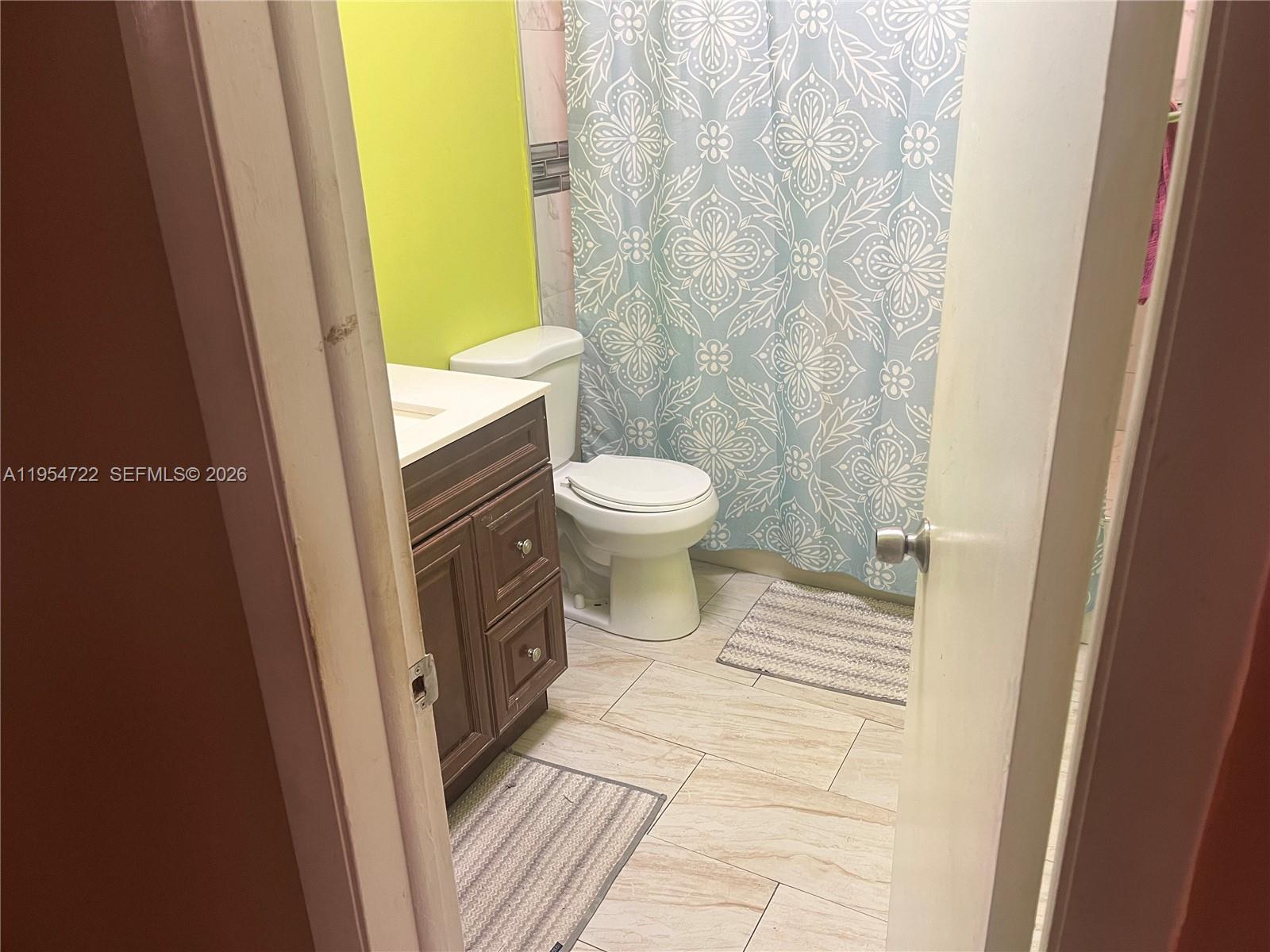 11041 Southwest 166th Terrace Miami, FL 33157 - Photo 18 of 26 a bathroom with a toilet and a shower