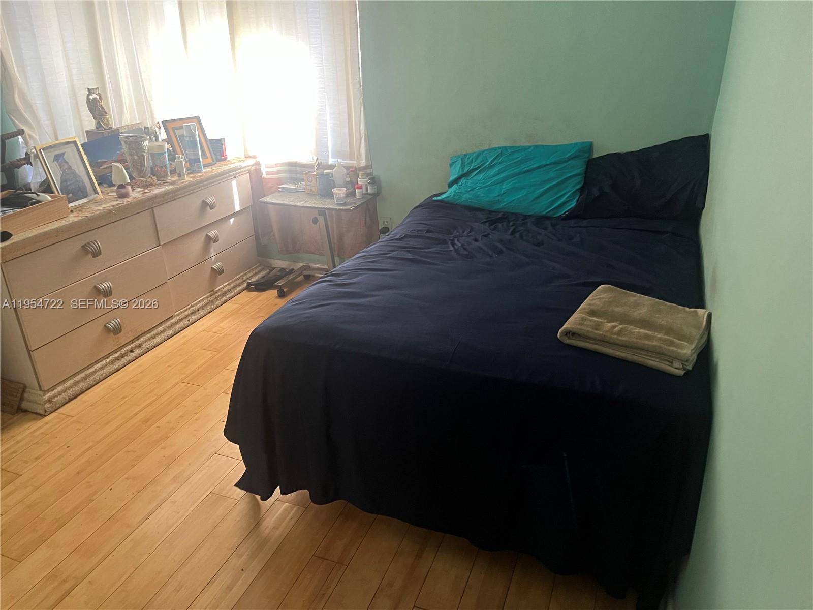 11041 Southwest 166th Terrace Miami, FL 33157 - Photo 22 of 26 a bedroom with a bed and a window
