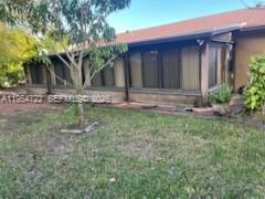 11041 Southwest 166th Terrace Miami, FL 33157 - Photo 23 of 26 a house with trees in front of it