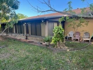 11041 Southwest 166th Terrace Miami, FL 33157 - Photo 24 of 26 a front view of a house with garden