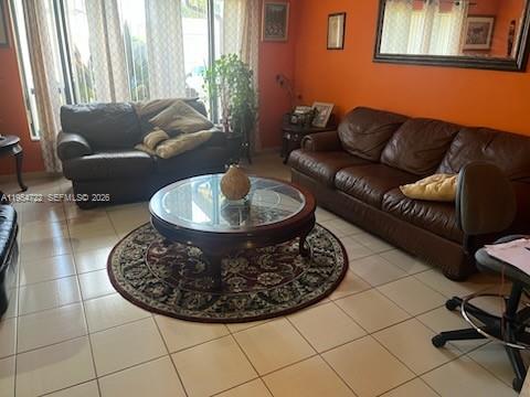 11041 Southwest 166th Terrace Miami, FL 33157 - Photo 7 of 26 a living room with furniture a lamp and a potted plant