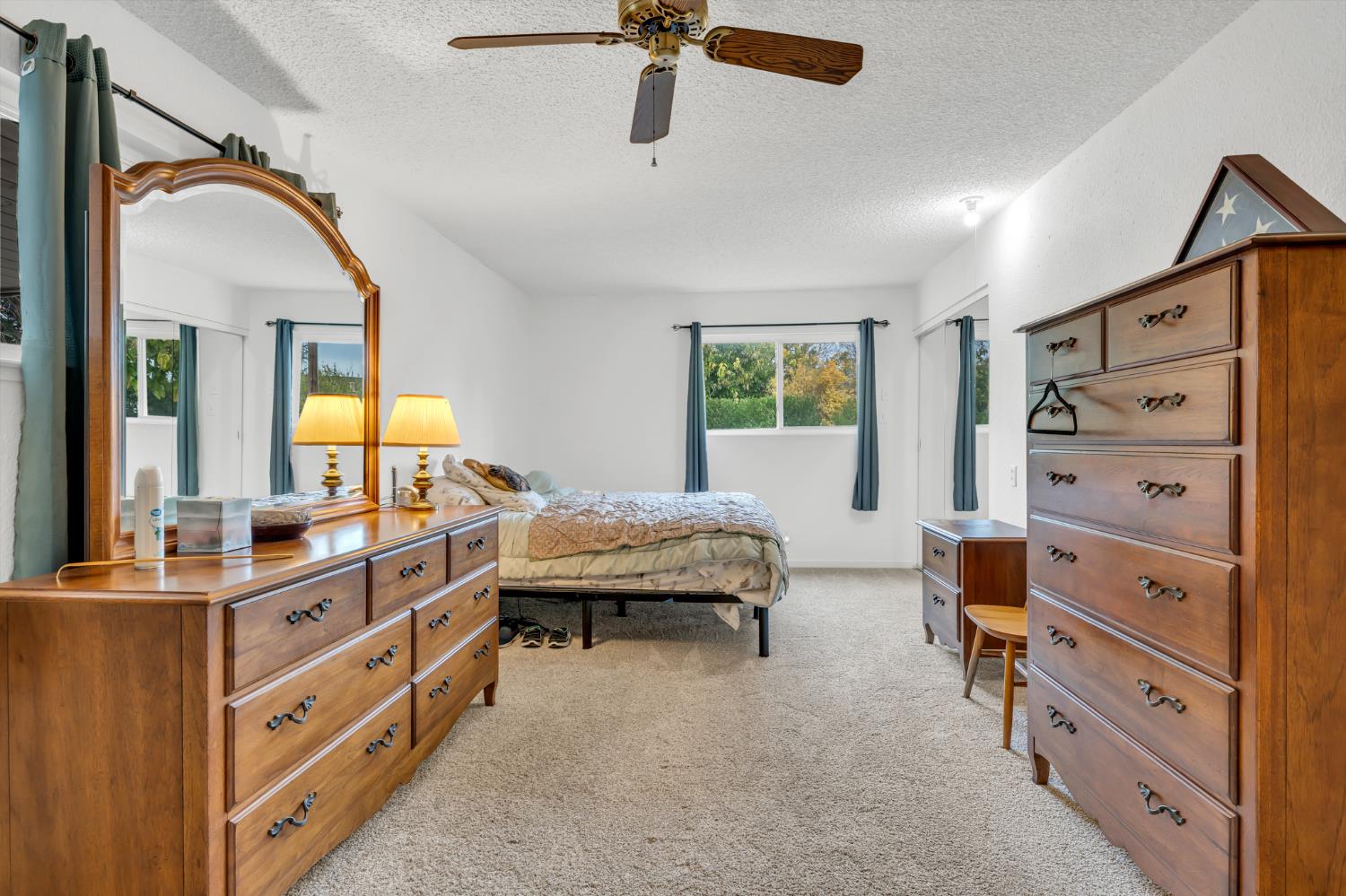 3307 Seaborg Way Sacramento, CA 95827 - Photo 24 of 45 a spacious bedroom with a bed and a dresser
