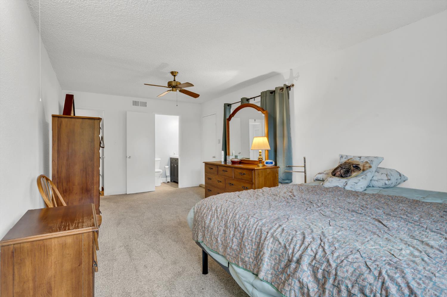 3307 Seaborg Way Sacramento, CA 95827 - Photo 25 of 45 a bedroom with a bed and a mirror