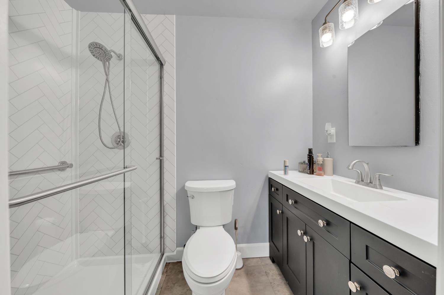 3307 Seaborg Way Sacramento, CA 95827 - Photo 27 of 45 a bathroom with a toilet sink shower and mirror