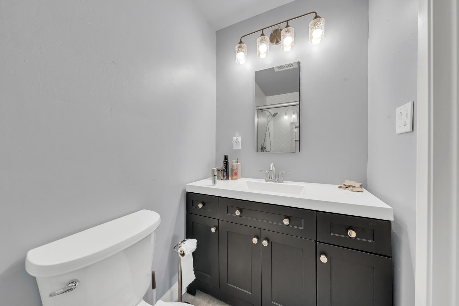 3307 Seaborg Way Sacramento, CA 95827 - Photo 29 of 45 a bathroom with a toilet sink and mirror