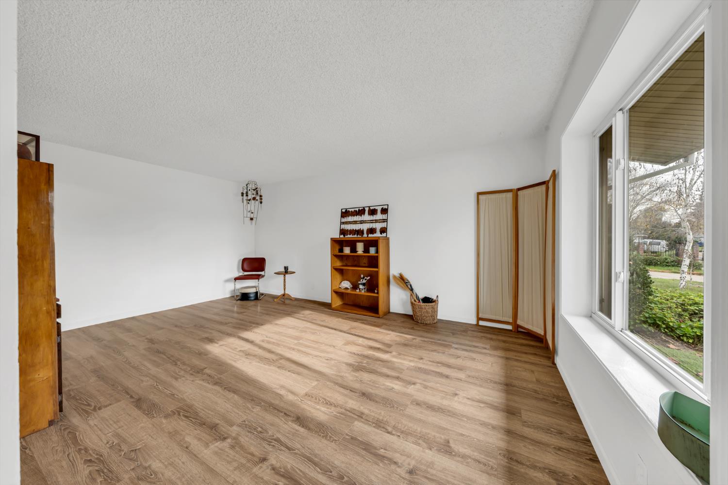 3307 Seaborg Way Sacramento, CA 95827 - Photo 6 of 45 a view of a room with wooden floor and windows