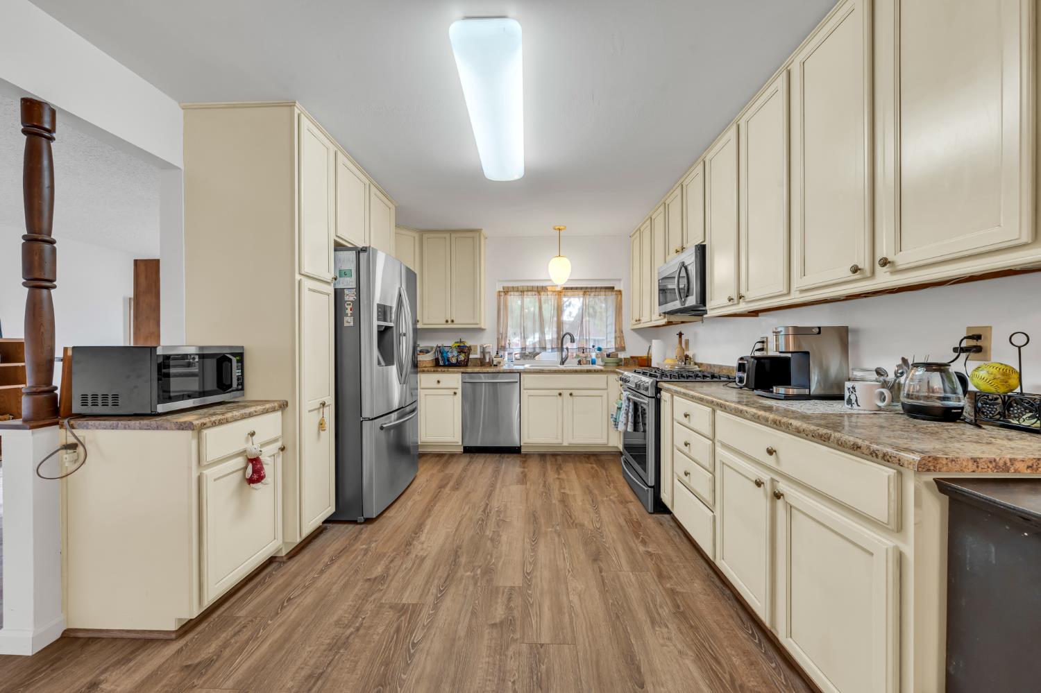 3307 Seaborg Way Sacramento, CA 95827 - Photo 9 of 45 a kitchen with white cabinets and white appliances