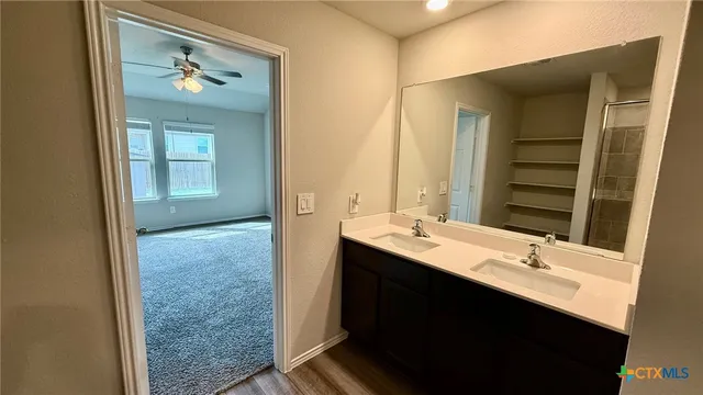 a bathroom with a glass shower door