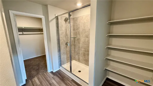a bathroom with a double vanity sink and mirror
